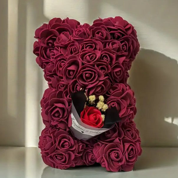 Rose bear with a bouquet of everlasting flowers