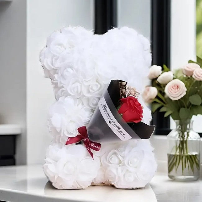 Rose bear with a bouquet of everlasting flowers