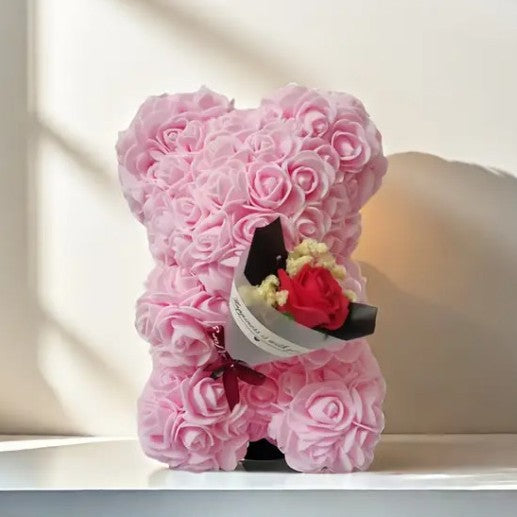 Rose bear with a bouquet of everlasting flowers